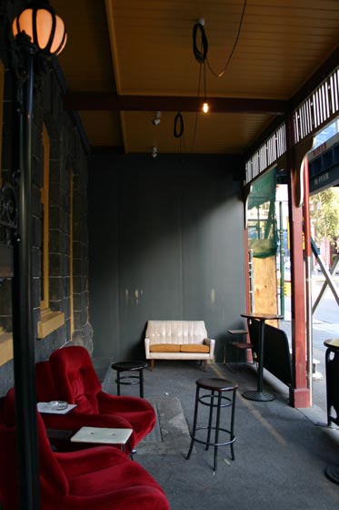 Red couches adorn the entrance on Franklin Street Melbourne